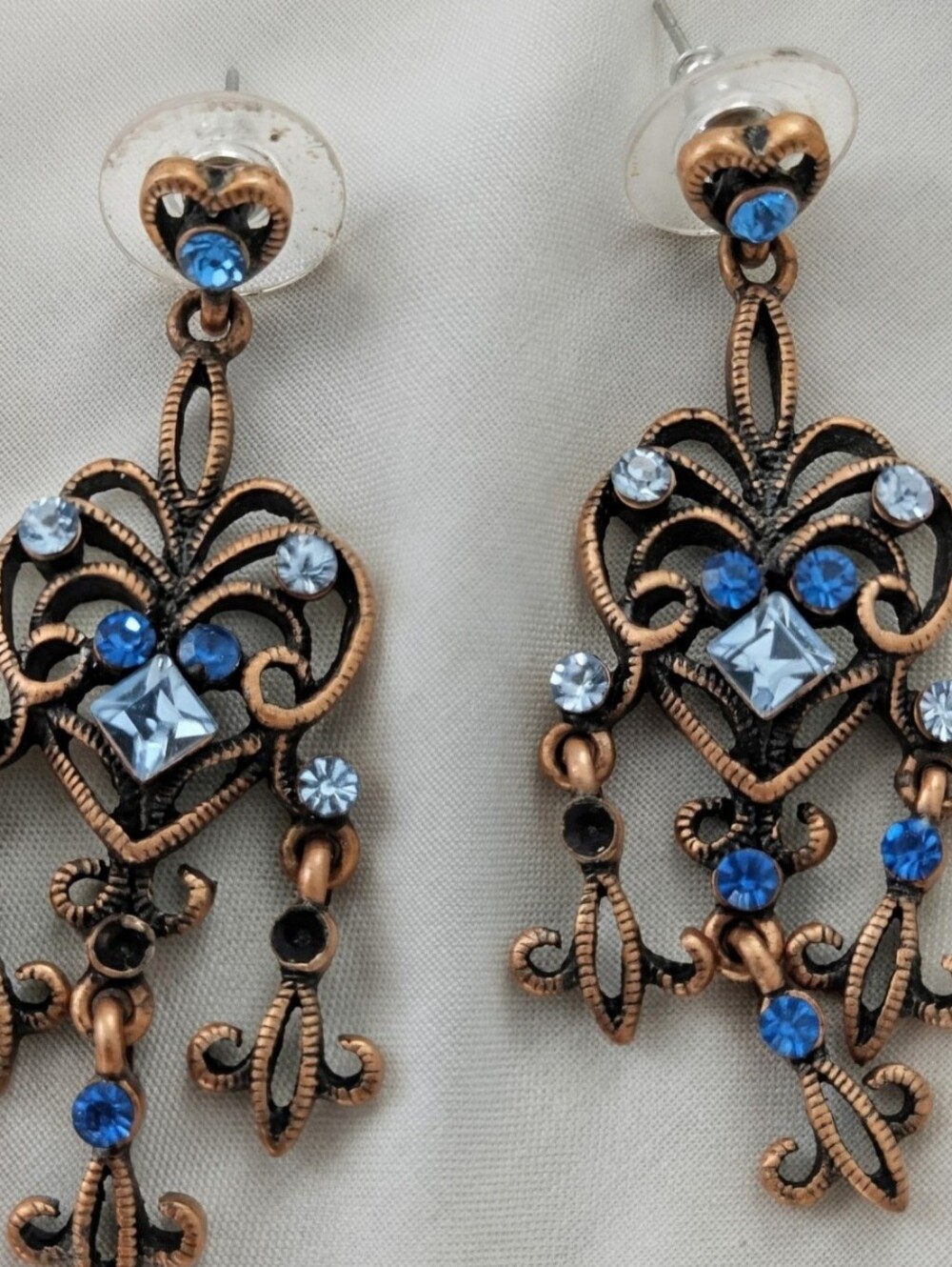 Copper and bronze Goldtone drop earrings with blue stones Like New. 1.5" drop